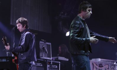 Noel, left, and Liam Gallagher, of Oasis, perform during the start of their Canadian tour in Vancouver, BC, on Aug. 27, 2008.