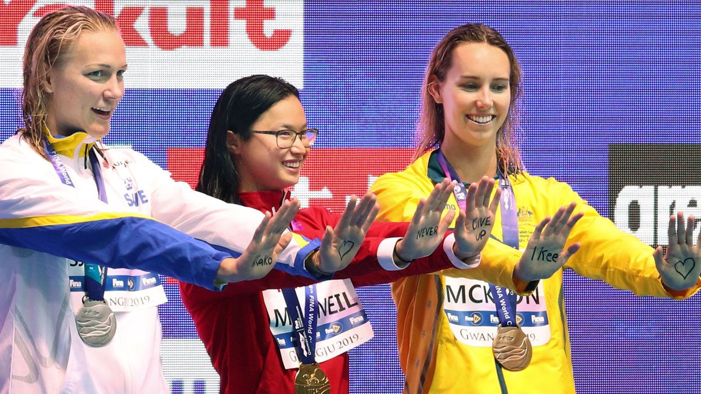 World swimming championships women's 100-butterfly gold medalist Margaret MacNeil (C) of Canada, silver medalist Sarah Sjoestroem (L) of Sweden and bronze medalist Emma McKeon of Australia