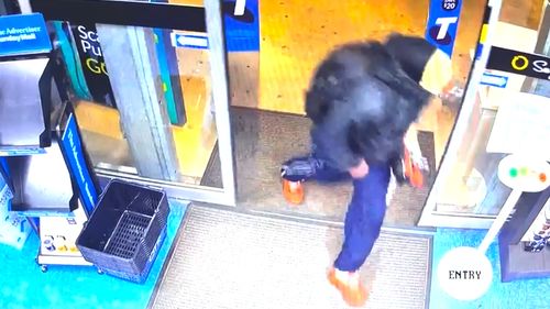 Police are searching for a man who allegedly stole cash and cigarettes from a service station in Adelaide while wearing a clown mask.
