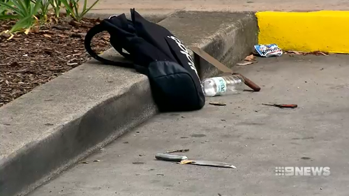 Police located a bag full of knives at the shopping centre carpark where the teen was arrested after stabbing three people at his Western Sydney school.