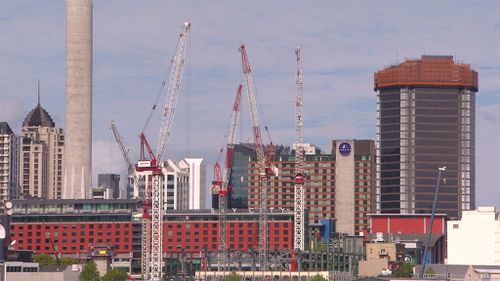 Cranes aiding the construction of new high-rises in Auckland (A Current Affair)