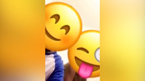 Two people can be heard defending their behaviour in another video, their faces obscured by emoji icons. (Snapchat)