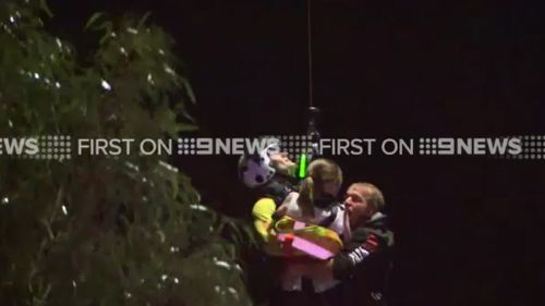 A man and girl were rescued from floodwaters at Inverleigh, west of Geelong. (9NEWS)