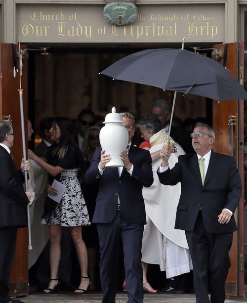 A white urn emerged from the moving service, which started with the song "Noel", Kate's middle name. (AAP)