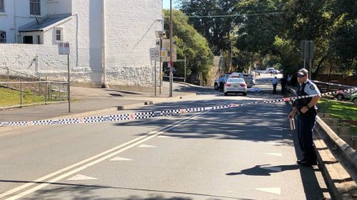 It's believed the man, aged in his 20s, was heard fighting with a man and a woman inside a house before staggering out onto the street covered in blood, suffering serious head injuries.