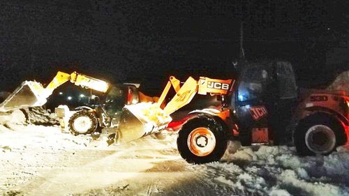 Tractors clearing snow in Chernihiv, Ukraine.