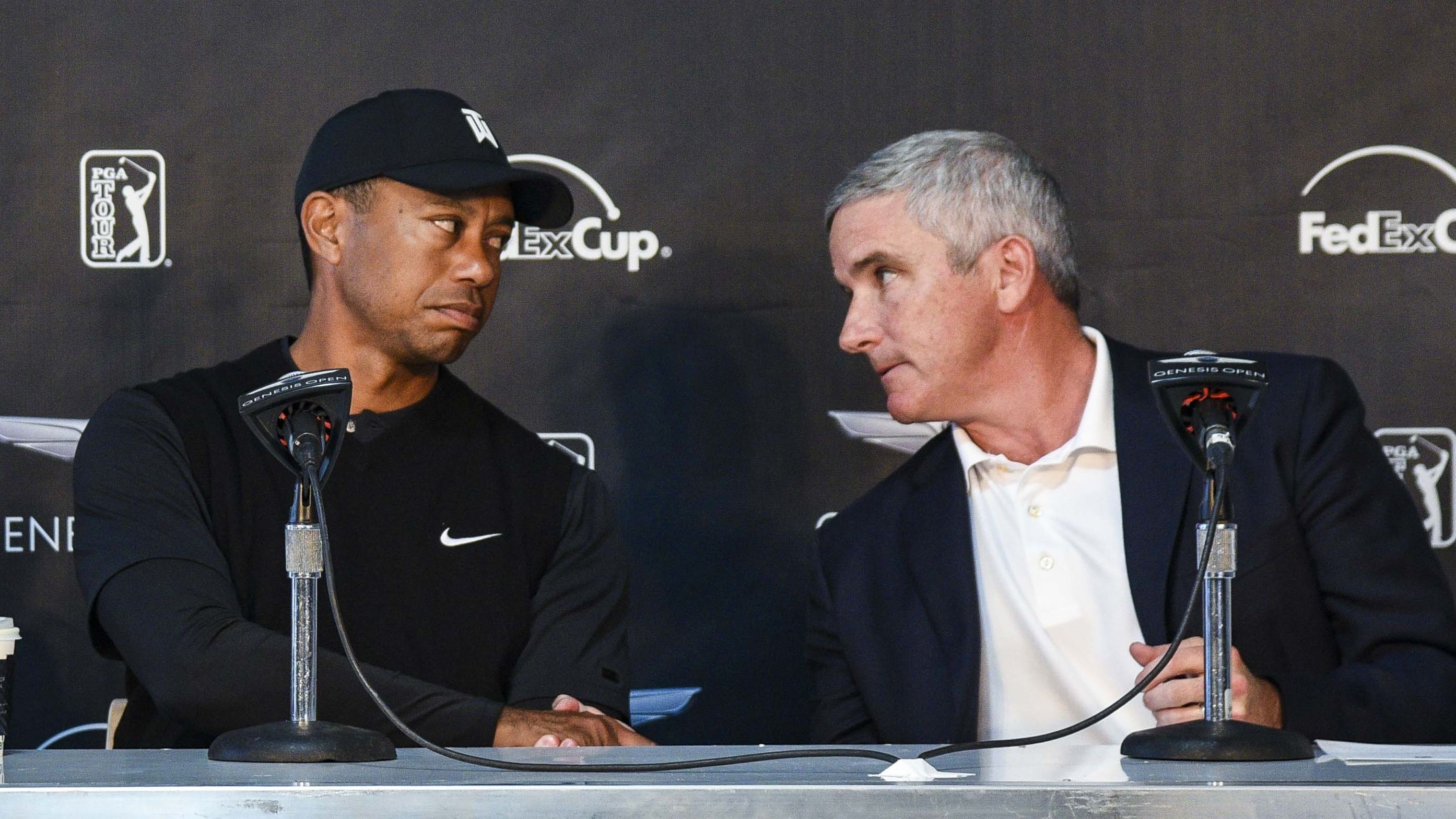 Tiger Woods and PGA Tour commissioner Jay Monahan.