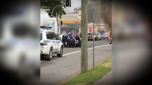 A group of police swarmed to bring Johnson to the ground during his arrest. Picture: 9NEWS