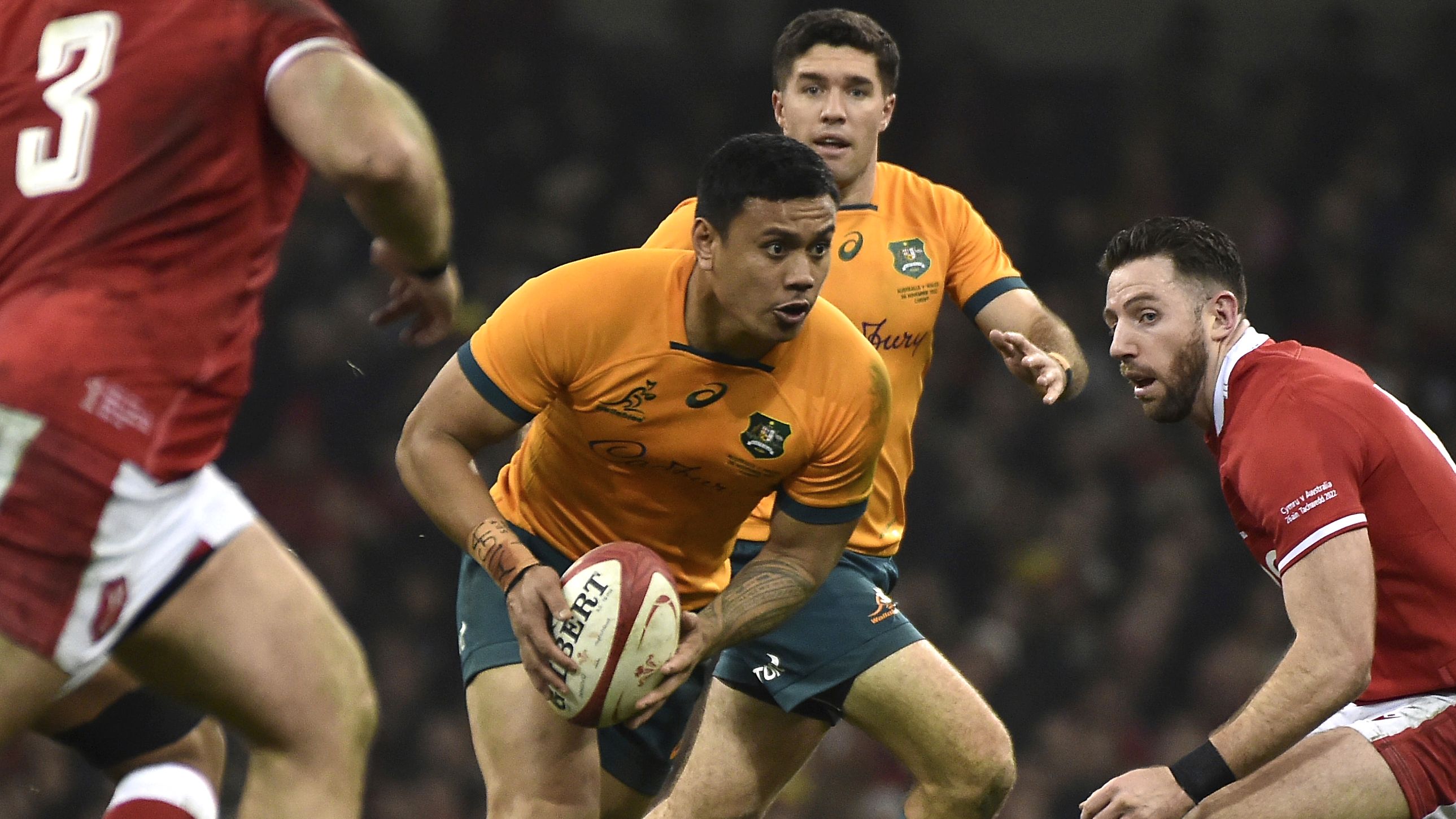 Len Ikitau, centre, runs with the ball during the rugby union international match between Wales and Australia 