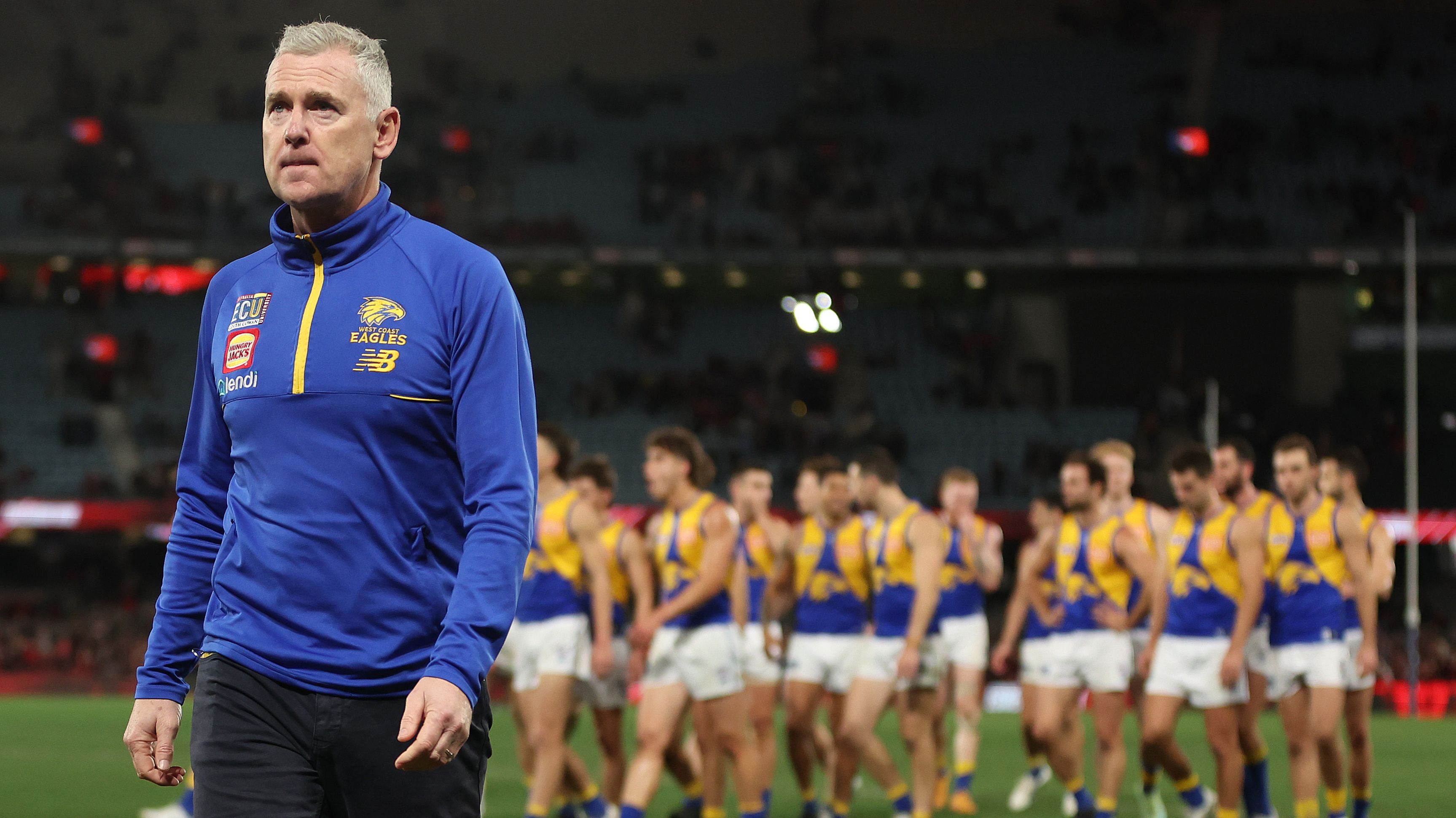 MELBOURNE, AUSTRALIA - AUGUST 05: Eagles coach Adam Simpson walks off after the Eagles were defeated by the Bombers during the round 21 AFL match between Essendon Bombers and West Coast Eagles at Marvel Stadium, on August 05, 2023, in Melbourne, Australia. (Photo by Robert Cianflone/Getty Images)