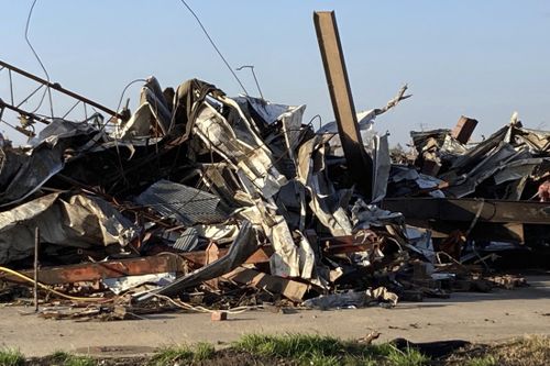 Debris covers a damaged structure in Rolling Fork, Miss,. on Saturday, March 25, 2023.  