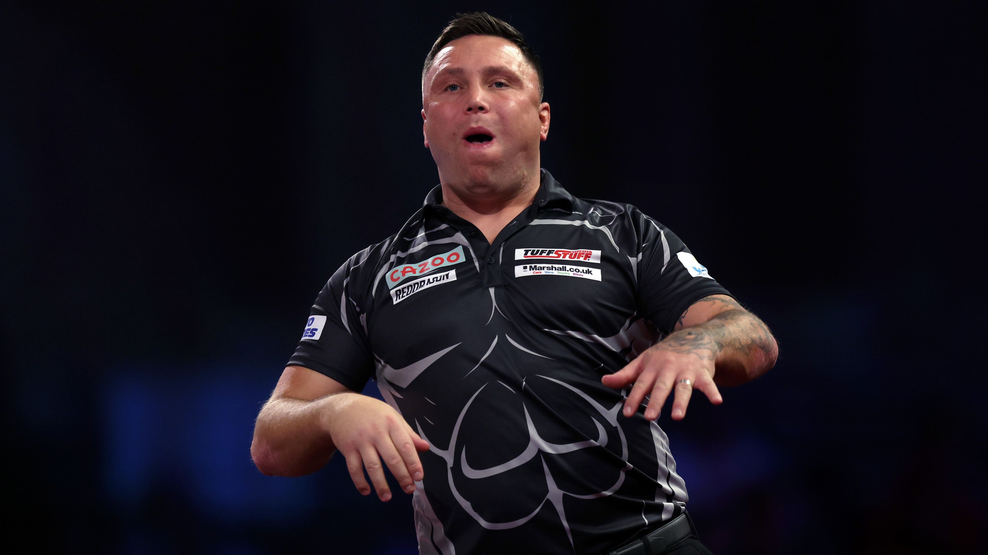 Gerwyn Price reacts after missing a triple 20 during his fourth round match against Jose de Sousa during the World Darts Championship.