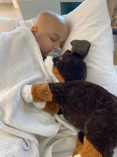 Isla leukaemia mother asleep in bed with toy