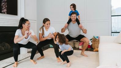 Sam and Snezana working out alongside their kids. 