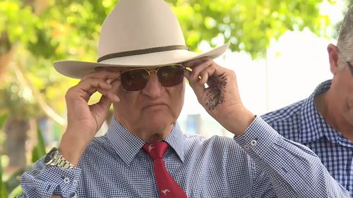 Mr Katter appeared to have written prompts on his hand before addressing the media today. 