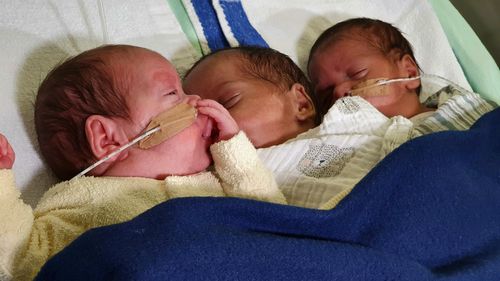 Townsville mum defies odds with 'one-in-a-half-million' chance birth of triplets