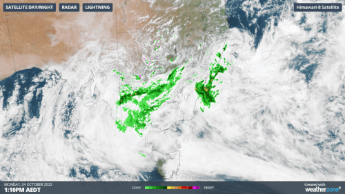 These satellite images shows two distinct low pressure systems affecting Australia on Monday.