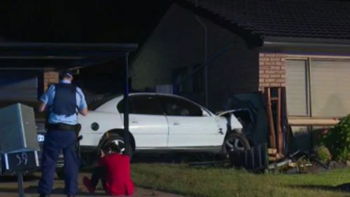 Man on the run are ploughing car into Sydney home