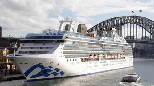 The Coral Princess docks at Circular Quay on July 13, 2022 in Sydney, Australia. The Coral Princess, currently experiencing a COVID-19 outbreak on board, arrived in Sydney on Wednesday morning. (Photo by Jenny Evans/Getty Images)