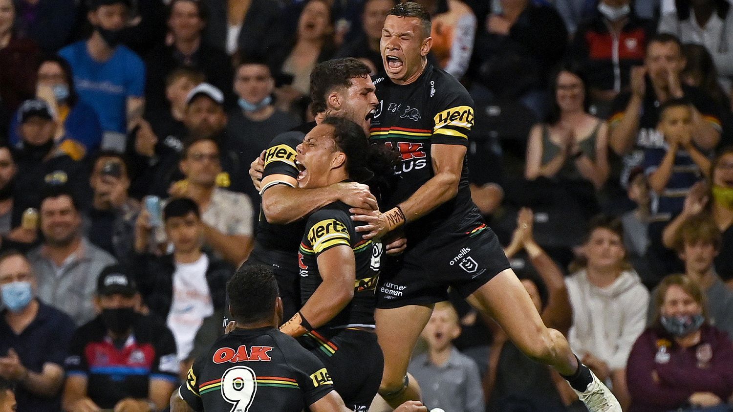 The Panthers celebrate a try.