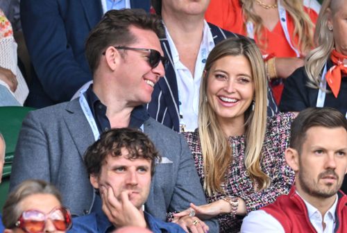 Nick Candy and Holly Valance laugh as they attend Day Four of Wimbledon 