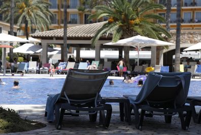 20 July 2022, Spain, Palma: Sun loungers are on the terrace of a swimming pool by the pool. Photo: Clara Margais/dpa (Photo by Clara Margais/picture alliance via Getty Images)
