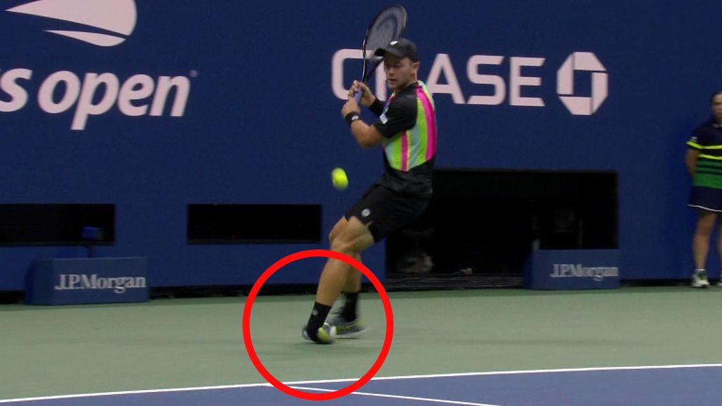 Dominik Koepfer rolls his ankle during the opening game of his first round match against Carlos Alcaraz.