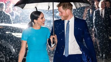 Prince Harry Meghan Markle blue dress rain umbrella