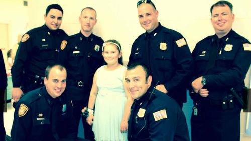 The officers said it was an honour to escort Jewel to the dance and a great way to keep Tim Warren's memory alive. (Memphis Police Department)