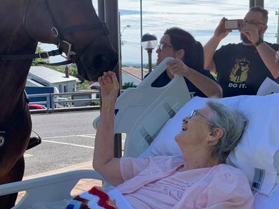 Rita Meredith being granted her final wish outside the hospice at Calvery Mater in Newcastle.