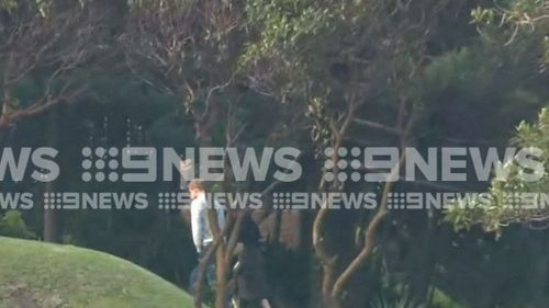 After a day laying low, the couple have been spotted by 9NEWS cameras strolling on the lawns of Admiratly House.