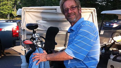 Tom Randele, whose real name according to authorities is Ted Conrad, tends to golf clubs, in September of 2012. 