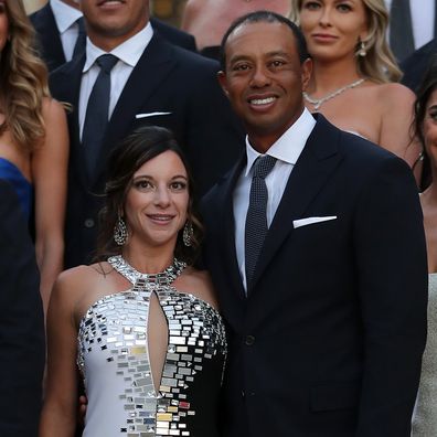 Tiger Woods of the United States poses with girlfriend Erica Herman before the Ryder Cup gala dinner.
