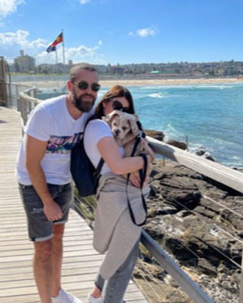 Mr Dew, pictured in Sydney with his partner Fern Jackson and their puppy.