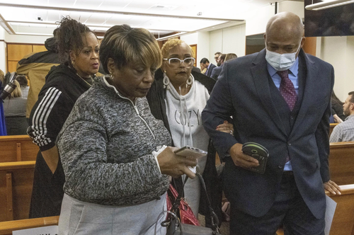 Manny Ellis' mother Marcia Carter-Patterson escorted out by her attorney and other family.