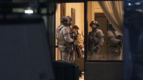 York Regional Police tactical officers work the scene of a fatal shooting in Vaughan, Ontario. Authorities said multiple people were shot and killed in a condominium unit in the Toronto suburb and the gunman was killed by police.  