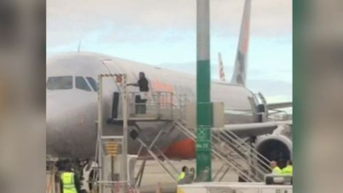 A man has been arrested after attempting to break into a Jetstar plane at Melbourne Airport. (9NEWS)