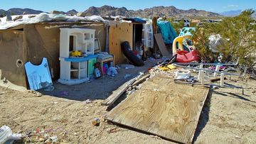 Mounds of trash and human faeces surrounded the desert property. (AP).