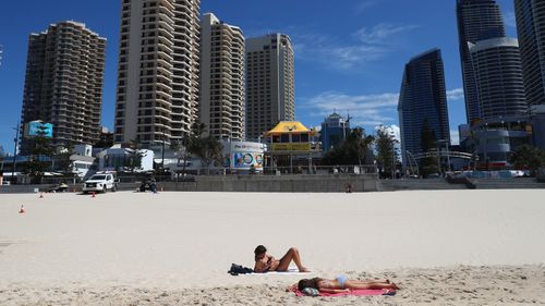 Man charged after 21-year-old falls from Surfers Paradise balcony