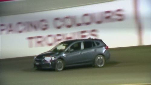 The woman drove through gates and onto the racing track.