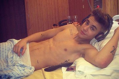 Even a stint in hospital won't stop Biebs from flashing his abs.