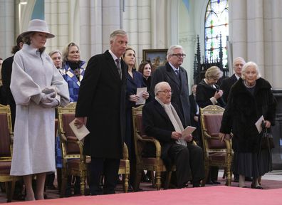 BRUSSELS, BELGIUM - FEBRUARY 20: (L-R) Queen Mathilde of Belgium, Princess Delphine of Belgium, the King Philippe of Belgium, Princess Claire of Belgium, Albert II of Belgium, Prince Laurent of Belgium and Queen Paola of Belgium attend the annual mass at the Notre-Dame church in Laeken, in memory of the deceased members of the Royal Family on February 20, 2024 in Brussels, Belgium.  (Photo by Thierry Monasse/Getty Images)