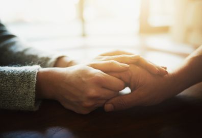 Couple holding hands