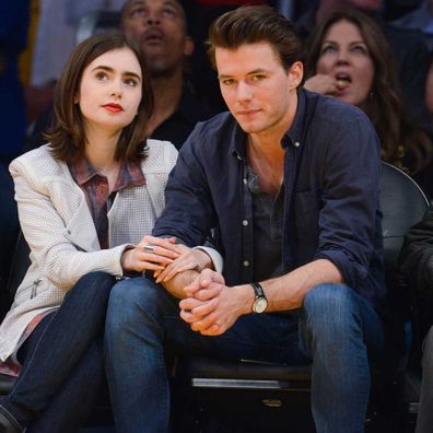 Lily Collins and Thomas Cocquerel attend a basketball game between the Chicago Bulls and the Los Angeles Lakers at Staples Center on February 9, 2014.