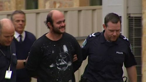 Marcus Stanford is led to court in South Australia. (9NEWS)
