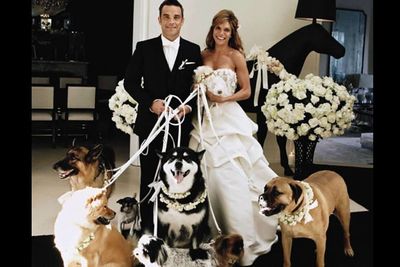 As if Robbie was ever going to have a straight-up wedding! The Take That singer insisted on having his dogs as bridesmaids.