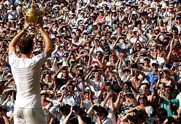 When did Andy Murray win the first of his two Wimbledon men's singles titles?