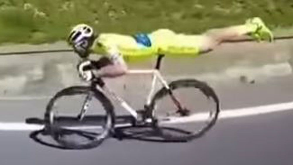 Cyclist adopts risky 'Superman' pose in bid to pick up speed