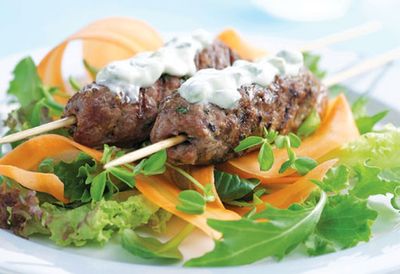 Beef skewers and carrot salad