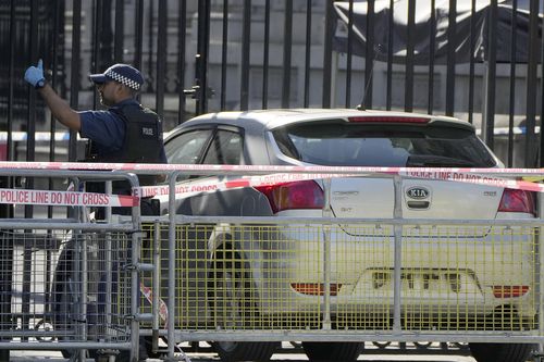 Police at the scene after a car collided with the gates of Downing Street in London in London, Thursday, May 25, 2023. 